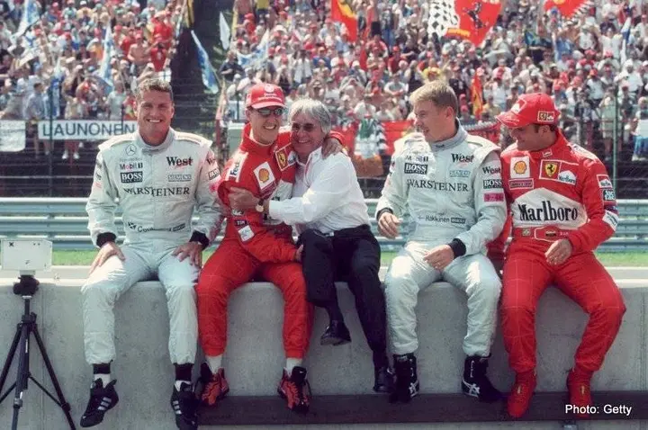BUDAPEST, HUNGARY - AUGUST 13: GP von UNGARN 2000, Budapest; v.l.n.r.: David COULTHARD/SCO, Michael SCHUMACHER/GER, Bernie ECCLESTONE, Mika HAEKKINEN/FIN, Rubens BARRICHELLO/BRA (Photo by Andreas Rentz/Bongarts/Getty Images)