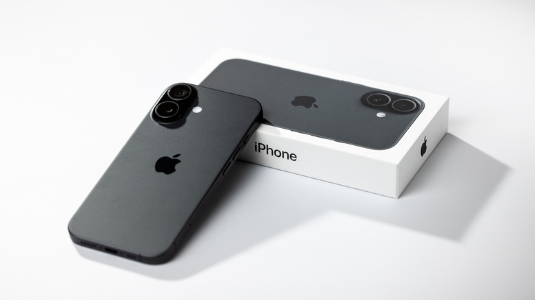 An iPhone 17 next to its box