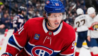 Kent Johnson wearing a Montreal Canadiens home jersey and helmet amid trade rumors linking him to the Canadiens