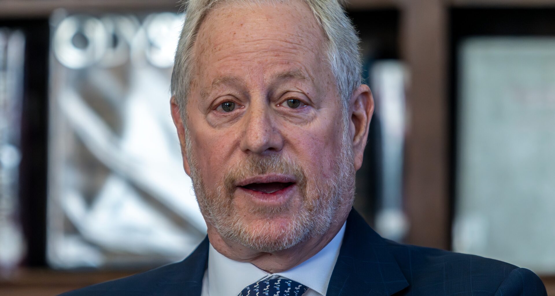 Head and shoulders picture of man speaking