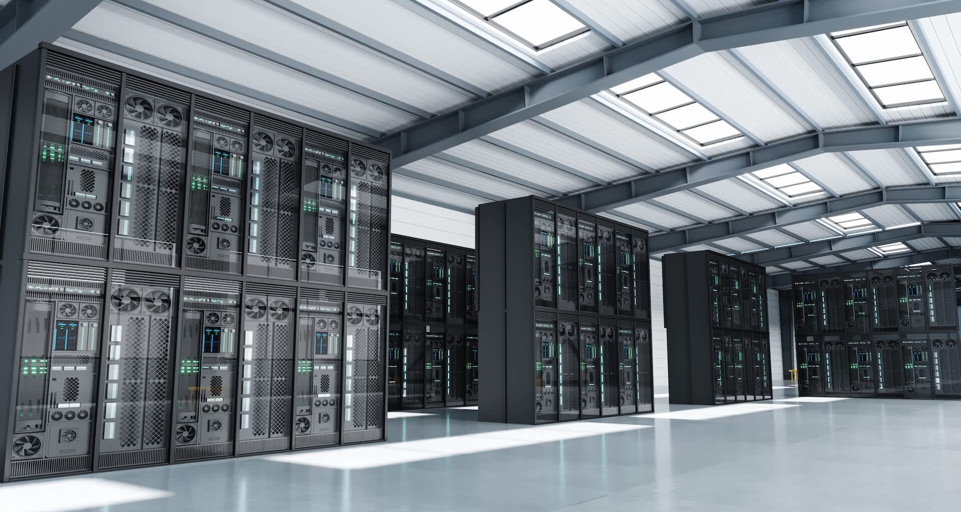 A data center featuring rows of server racks in a spacious, modern facility.