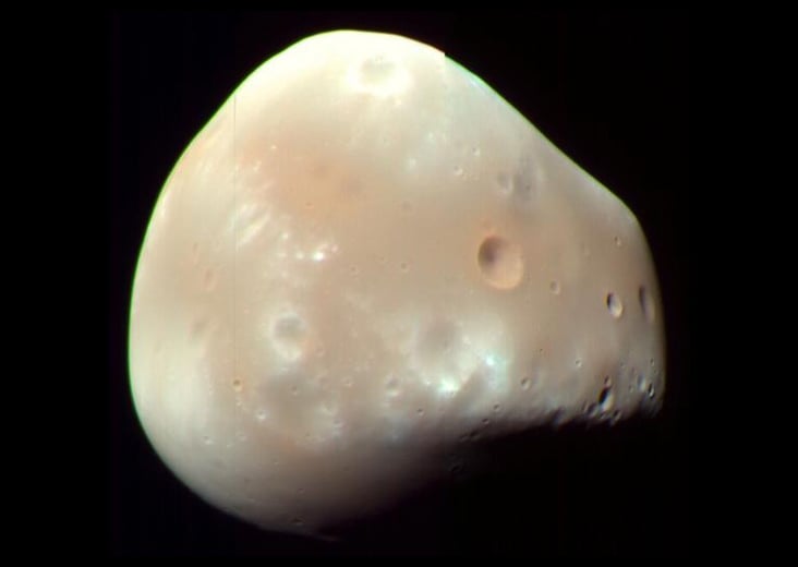 Deimos may owe both its enormous south-polar depression and strangely smooth surface to a single 300-metre asteroid impact — a blow whose debris spread around the entire moon and would mean Mars’s smaller satellite is essentially a porous rubble pile
