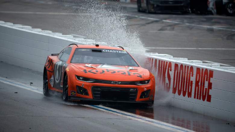 Ross Chastain, driver of the #1 Kubota Chevrolet, drives through a puddle prior to the restart after a weather delay
