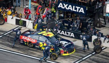 High-angle view of a NASCAR pit crew servicing the colorful number 24 stock car during a fast pit stop in pit lane. Photo by Andrew Roberts on Unsplash