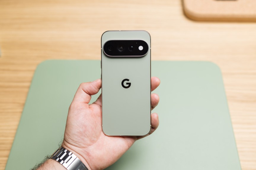 A hand holding a Google Pixel phone