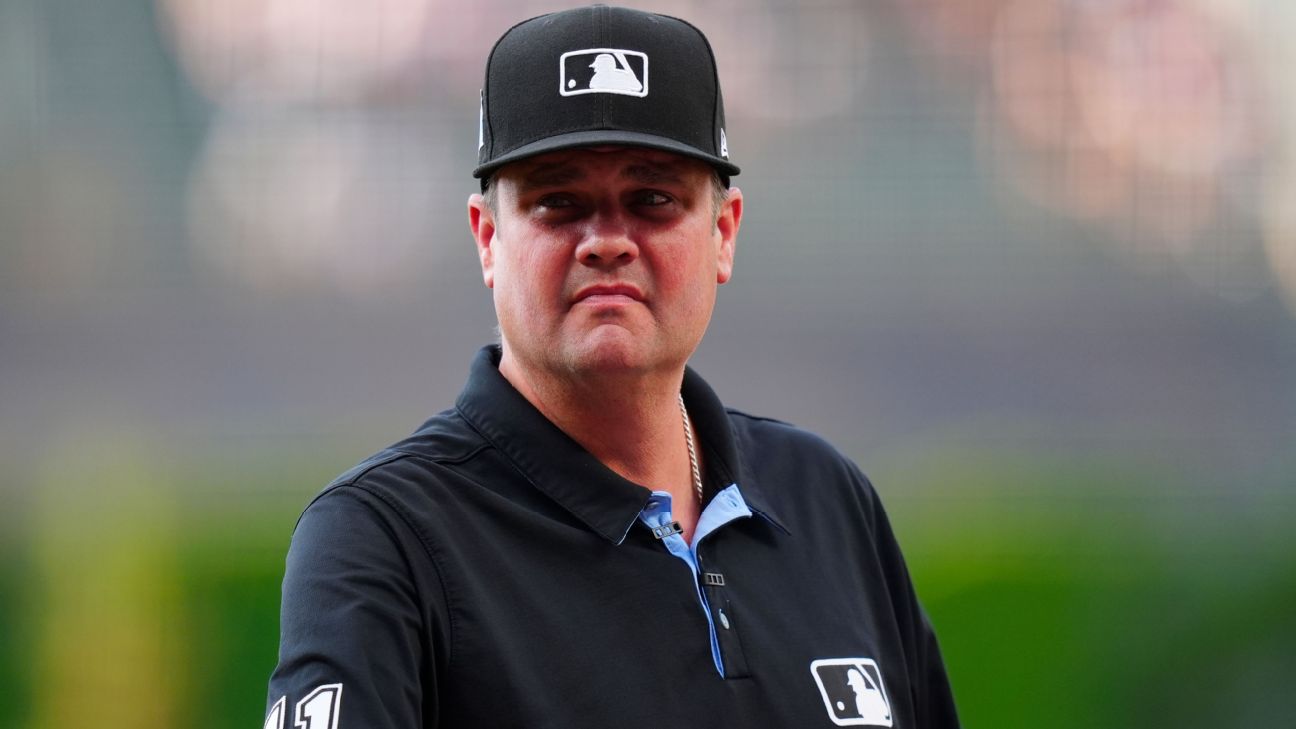 Umpire Jordan Baker exits with concussion symptoms after ball hits mask