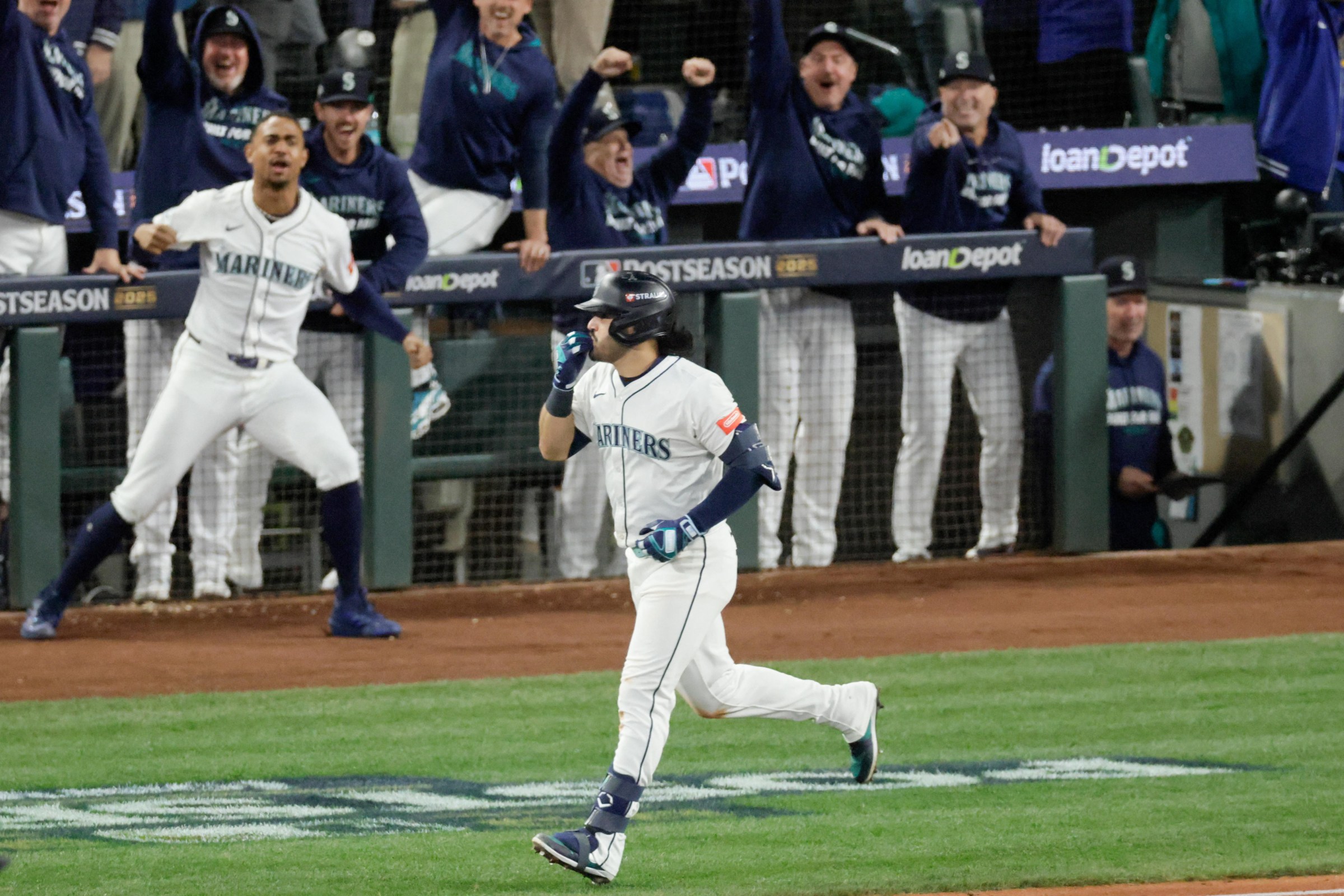 Oct 17, 2025; Seattle, Washington, USA; Seattle Mariners third baseman Eugenio Suarez (28) rounds the bases after hitting a grand slam against the Toronto Blue Jays in the eighth inning during game five of the ALCS round for the 2025 MLB playoffs at T-Mobile Park. Mandatory Credit: John Froschauer-Imagn Images