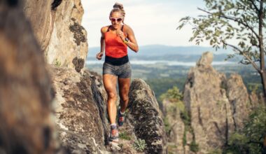 woman running on mountain cliff
