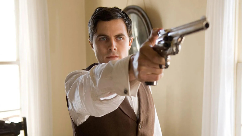 Robert Ford fires his gun in 