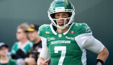 Darian Durant congratulates Riders quarterback Trevor Harris for surpassing 40,000 yards