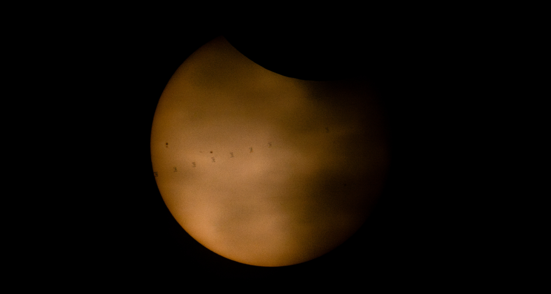 ISS photobombs the sun during solar eclipse photo of the day for Aug. 14, 2026