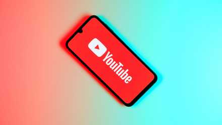 YouTube logo on a phone on top of gradient background