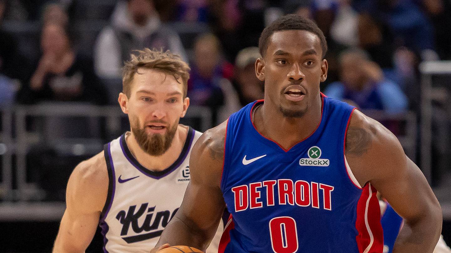 Jan 25, 2026; Detroit, Michigan, USA; Detroit Pistons center Jalen Duren (0) moves the ball up court in front of Sacramento Kings forward Domantas Sabonis (11) during the during the second half at Little Caesars Arena. Mandatory Credit: David Reginek-Imagn Images