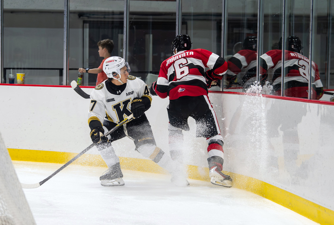 Hockey players behind the crease 