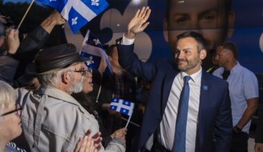 Parti Québécois Leader Paul St-Pierre Plamondon waves to his supporters as he arrives at the National Assembly in Quebec City