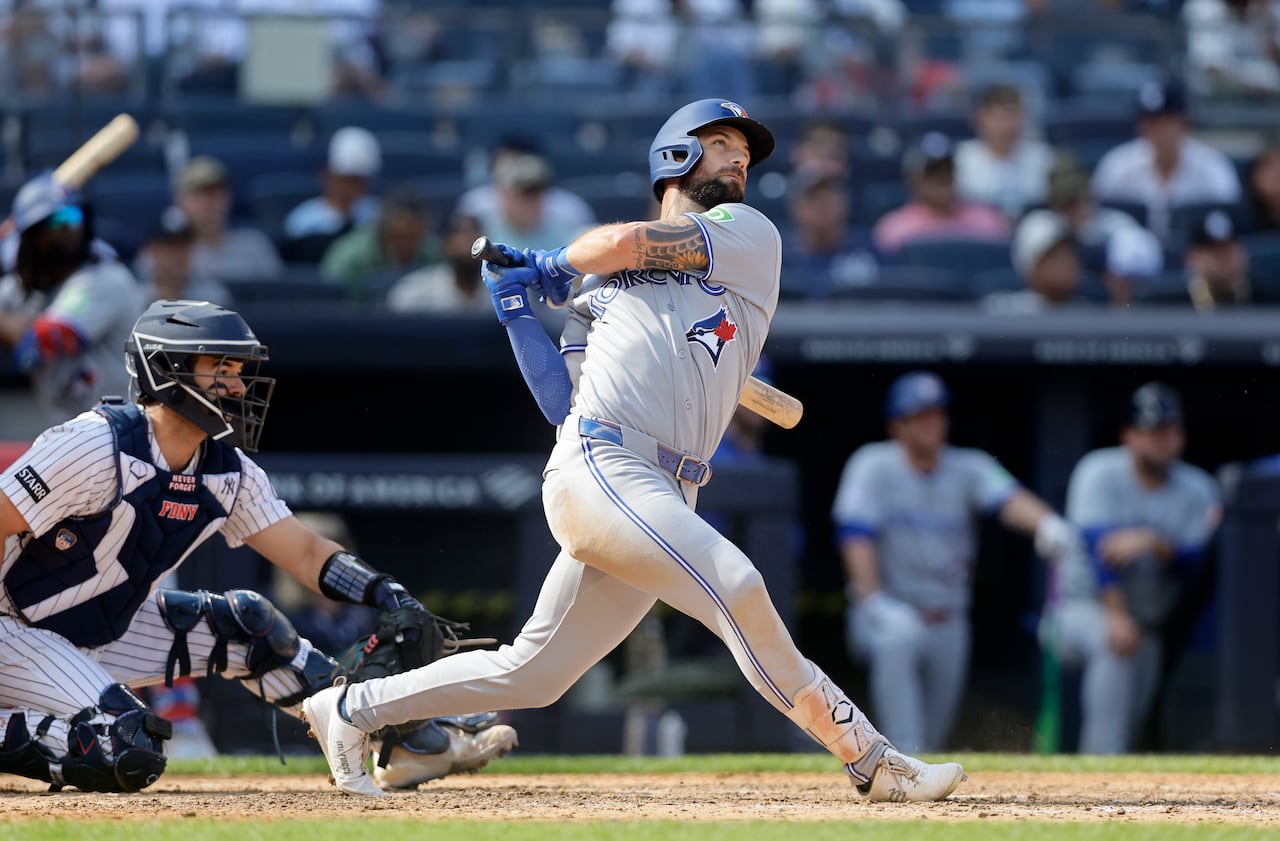 Blue Jays outfielder Nathan Lukes finishing his swing on a hit that was a home run at Yankee Stadium.