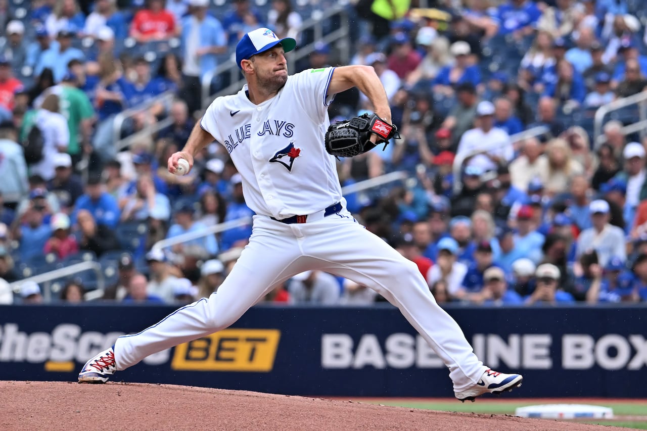 Blue Jays pitcher Max Scherzer delivering a pitch off the mound during a game against the Seattle Mariners.
