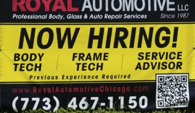 FILE - A now hiring sign is seen in front of an auto body shop in Chicago, June 25, 2026. (AP Photo/Nam Y. Huh, file)
