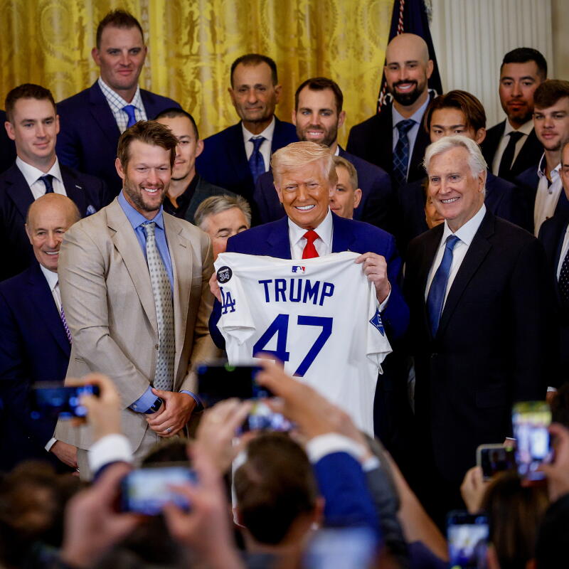 Dodgers pitcher Clayton Kershaw, President Donald Trump, and Dodgers Owner and Chairman Mark Walter pose with a jersey