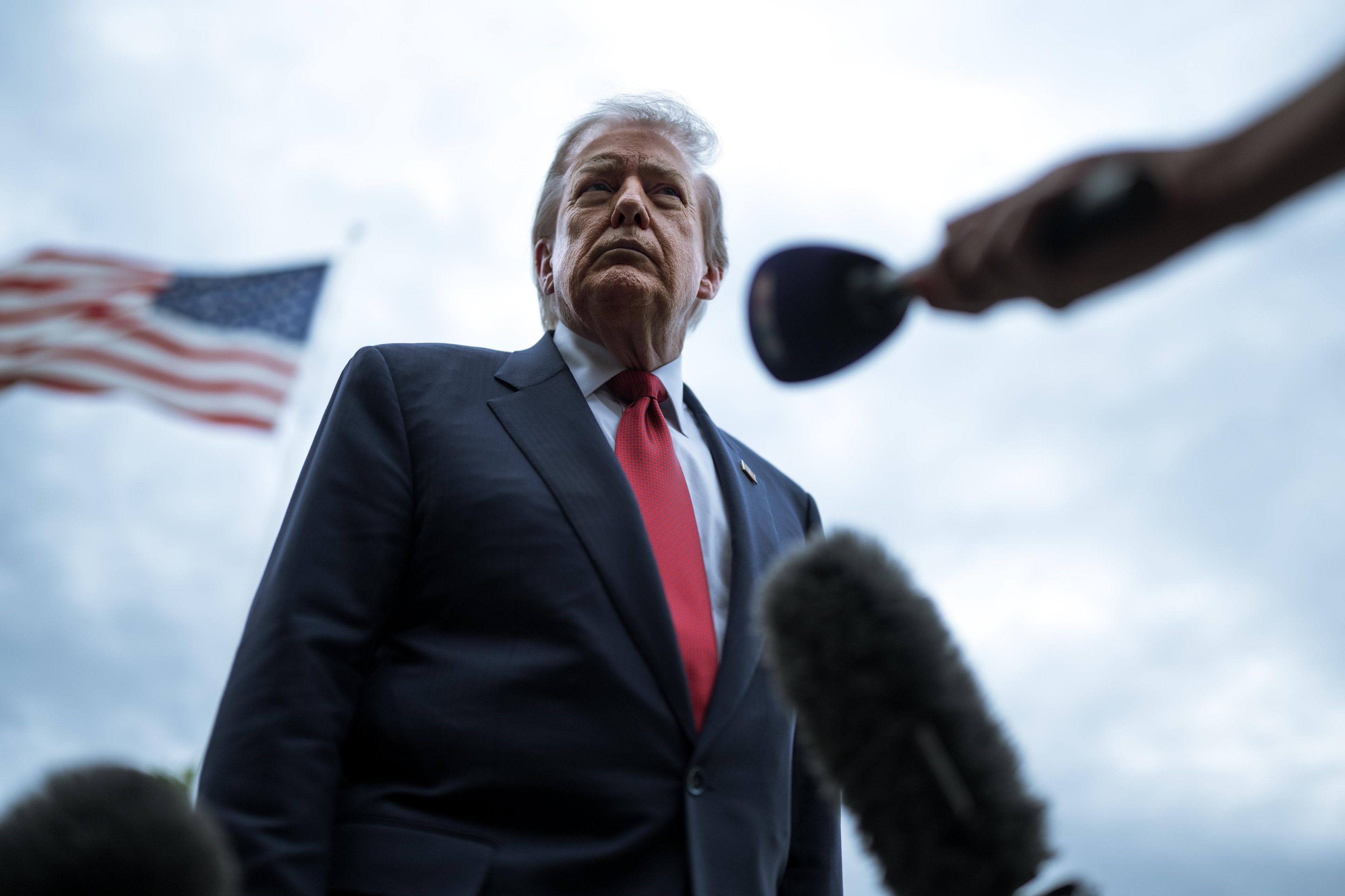 Donald Trump speaking with reporters from the White House South Lawn.