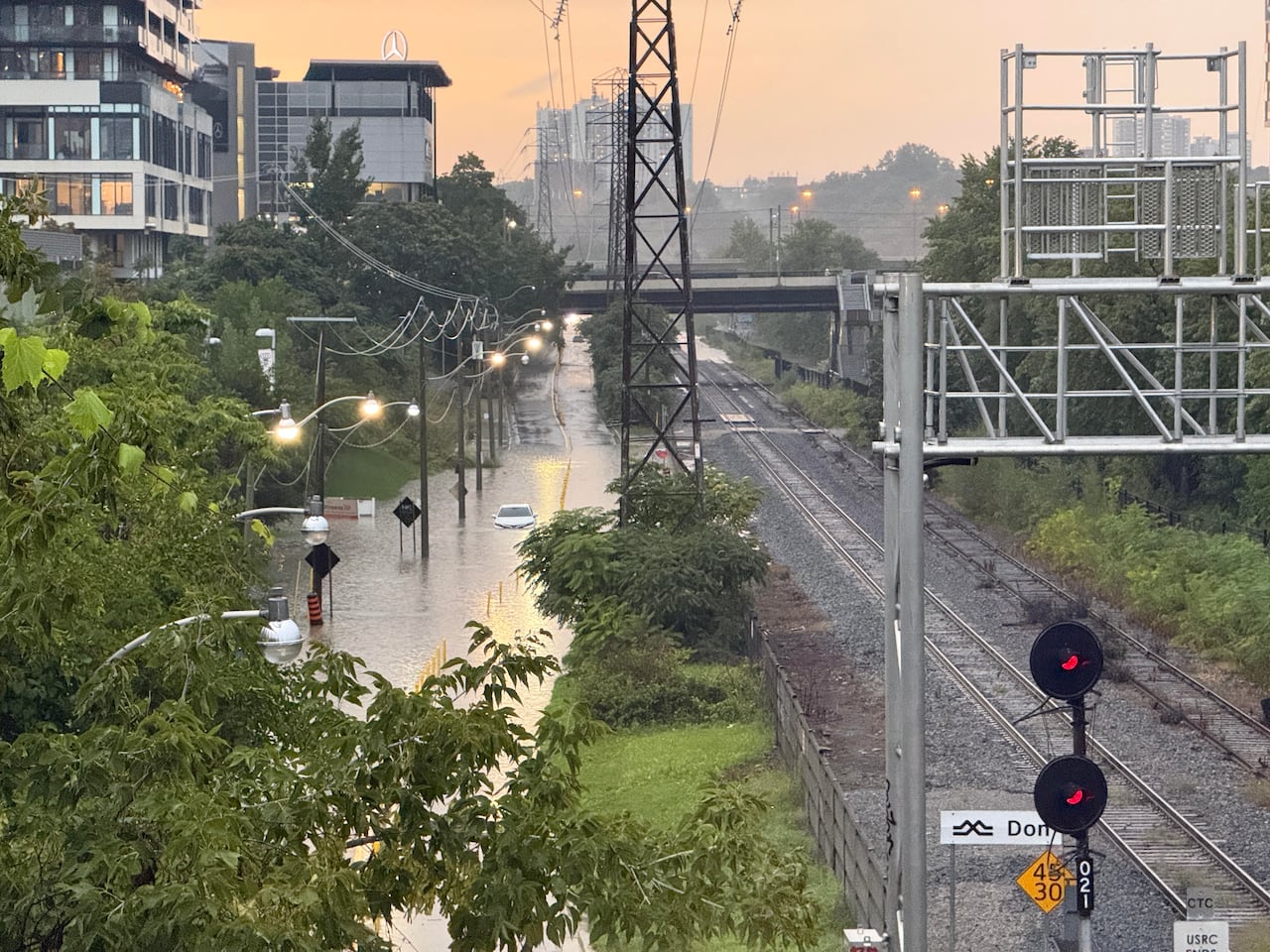 A view from the Riverside bridge in Toronto shows a car submerged