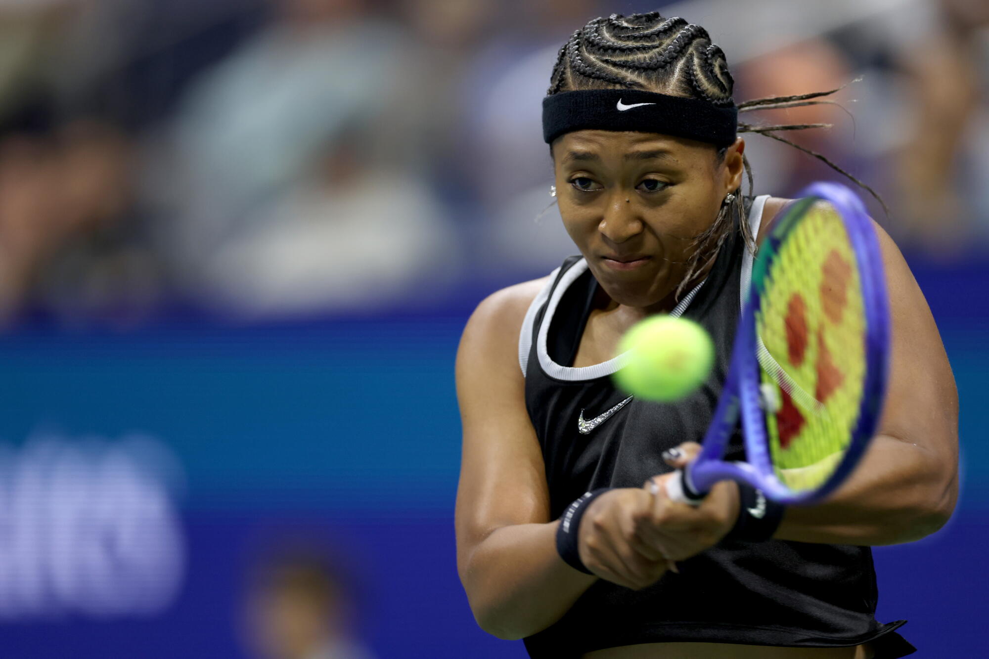 Naomi Osaka returns a shot against Anastasia Zakharova during their opening round match at the U.S. Open on Aug. 31.