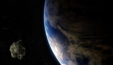 Earth as seen from space on the right with a small rocky body on the left.