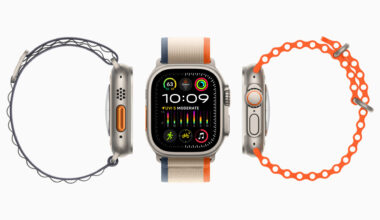Center: Apple Watch with striped fabric band, flanked by coiled watch bands on each side against a white background as a product shot.