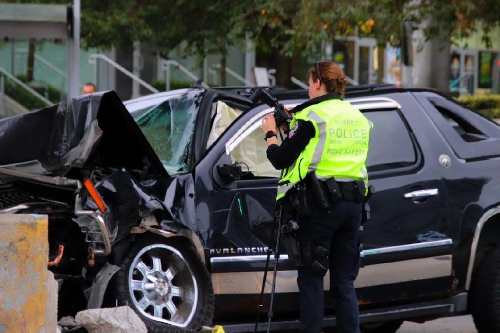 PHOTOS: SUV crashes at SkyTrain pillar in Surrey, IIO called to investigate