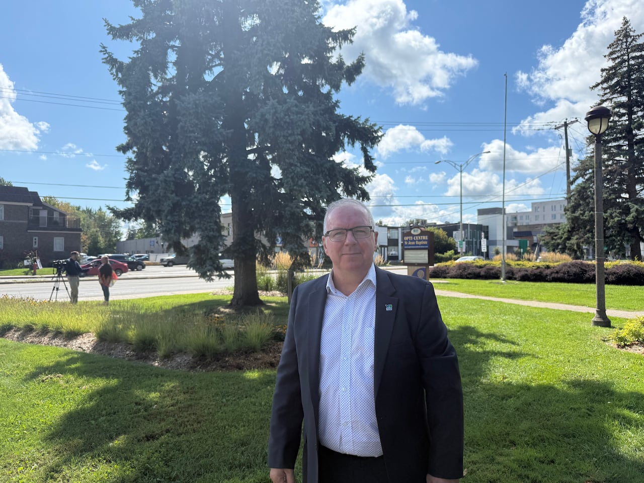 Mayor of Vaudreuil-Dorion in suit outside of highway 20 in Dorion