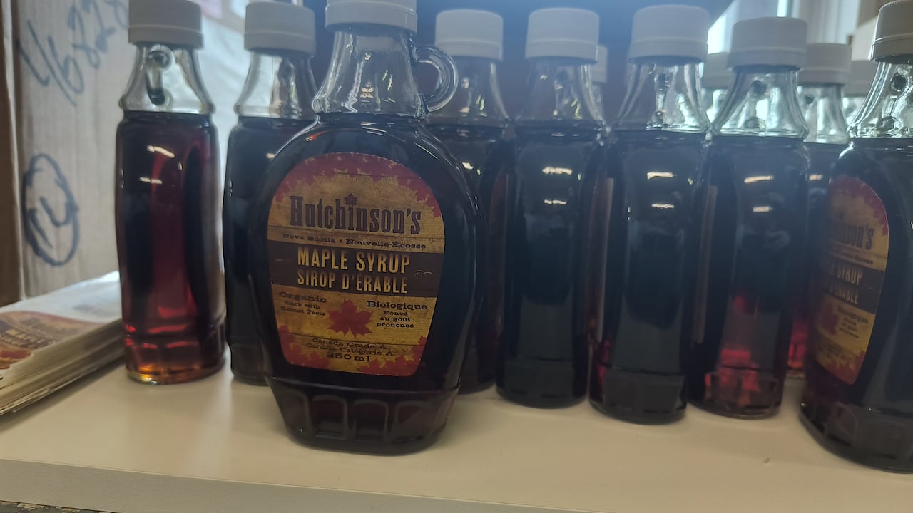 A jar of Hutchinson's maple syrups alongside many other jars