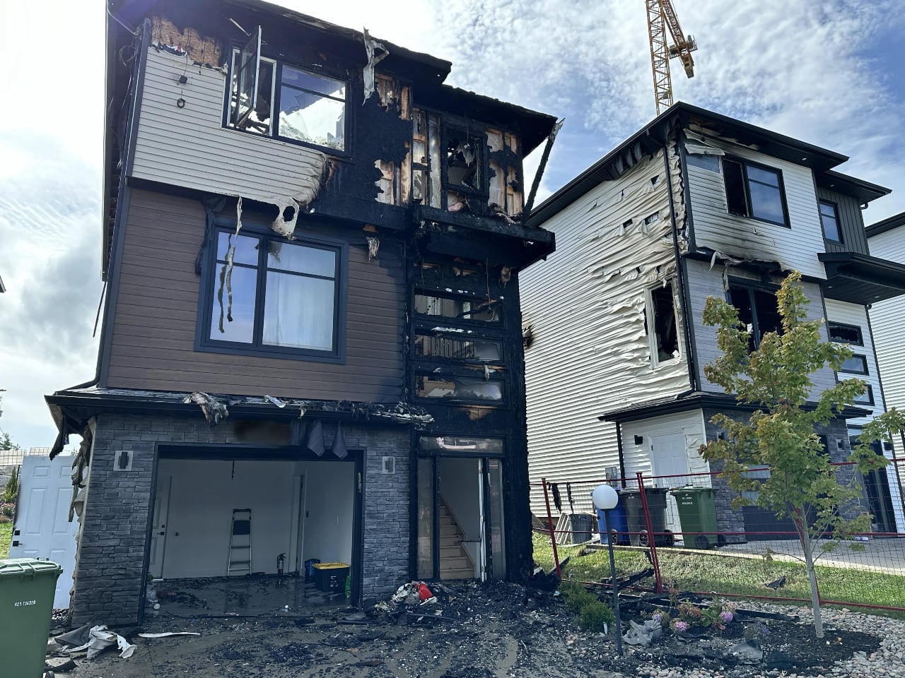 Two burned houses stand side by side.