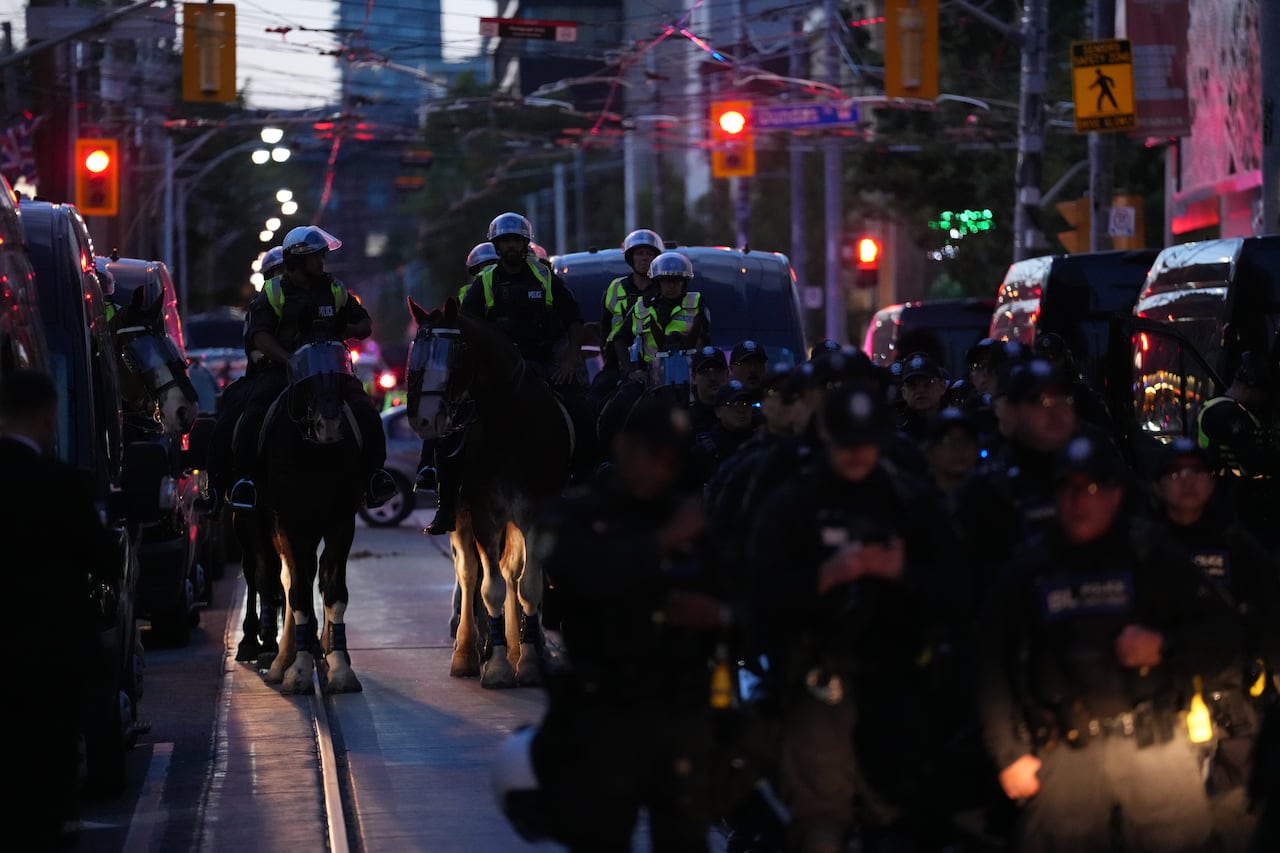 Protesters hold a march in opposition to the Canada Investment Summit, organized by Prime Minister Mark Carney, in Toronto on Sept. 14, 2026.