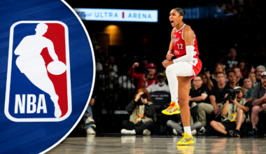 Aug 20, 2026; Las Vegas, Nevada, USA; Las Vegas Aces center A'ja Wilson (22) reacts after scoring against the Connecticut Sun during the third quarter of a WNBA basketball game at Michelob Ultra Arena. A photo of the NBA logo on has been added to the left side.