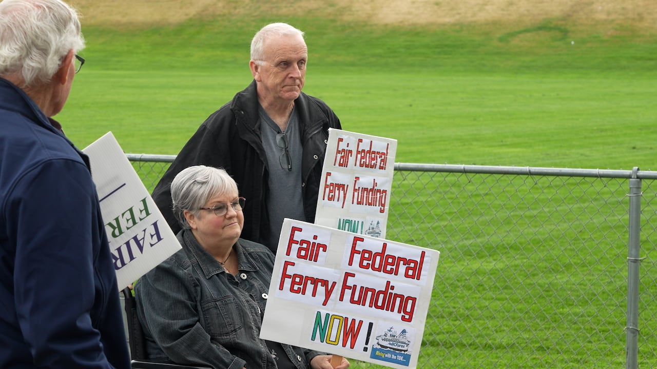 A pair attend the Parksville rally, which kicked off a week of rallies in support of JOhn's motion, which he says has received bi-partisan support.