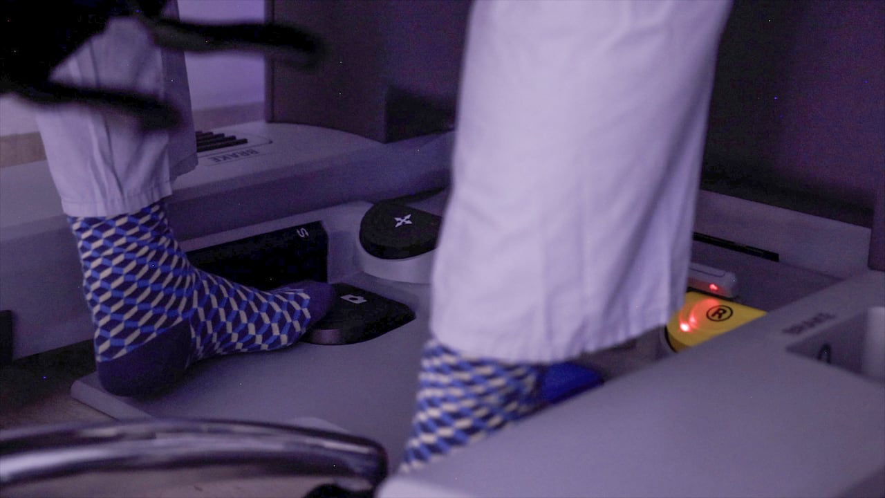 Feet in socks at surgery machine.