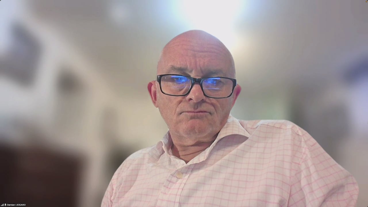 A man in a white shirt.