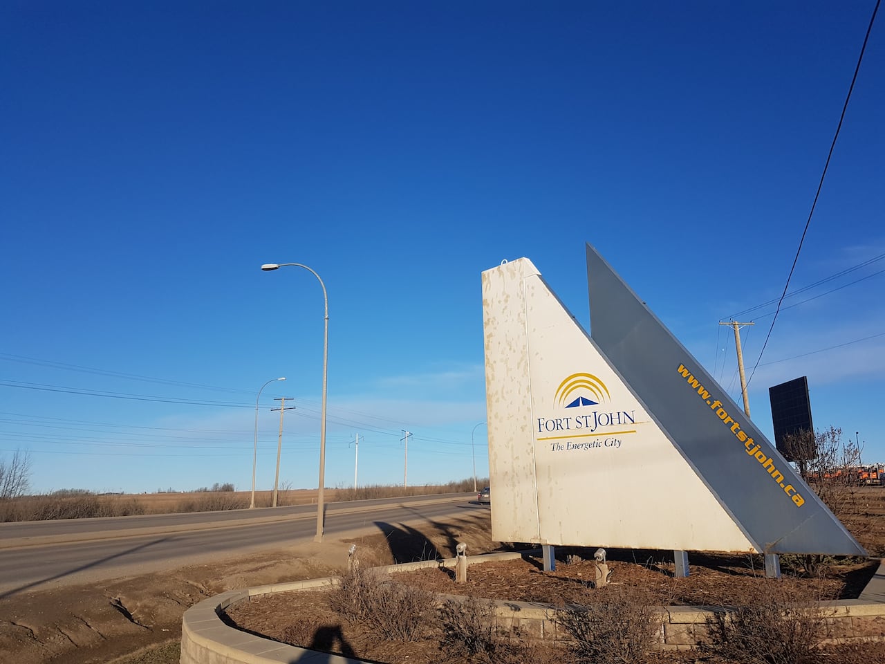 A sign reads 'Fort St. John The Energetic City.'