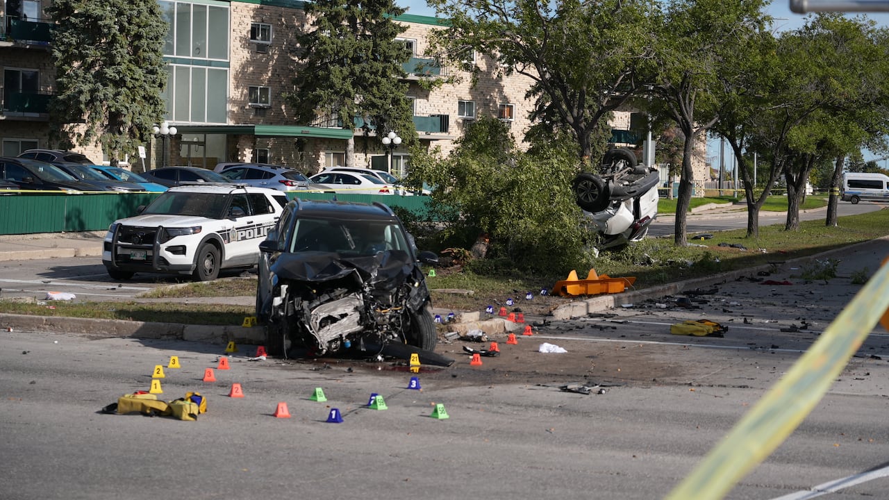 Two vehicles are heavily damaged and one is upside down.