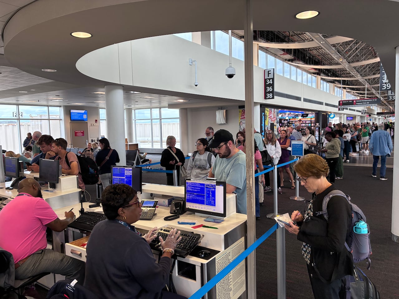 Lines of people in airport