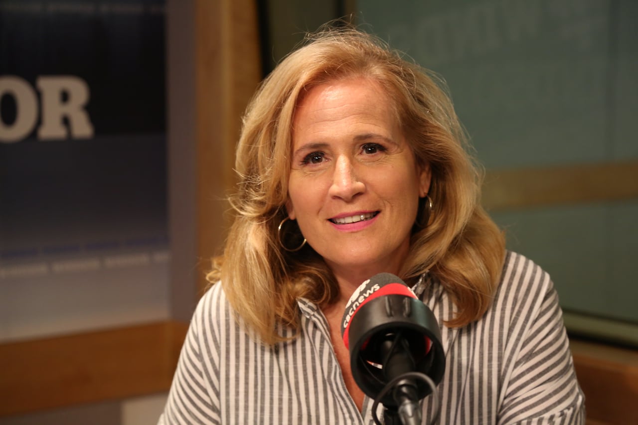 A woman in a recording studio.