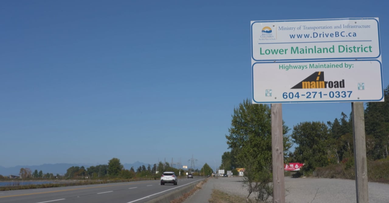 A stretch of highway with a sign that has the B.C. Ministry of Transportation's name on it
