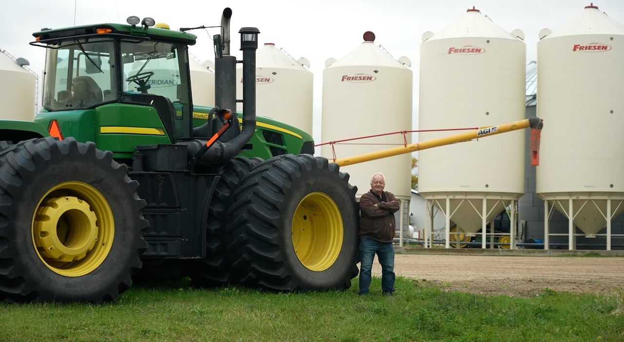Man beside tractor