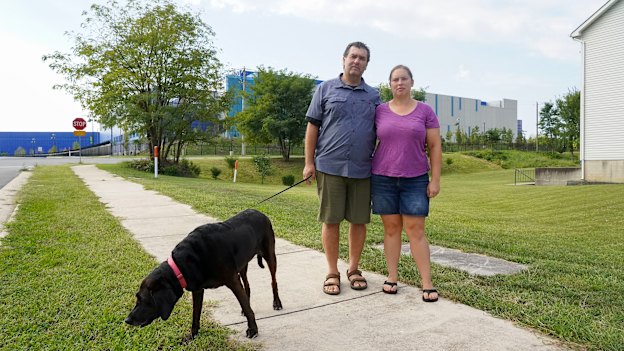 Lindsay Shaw and partner Bob Salehi outside the Ashburn II Data Centre Campus, which is just metres from their home.