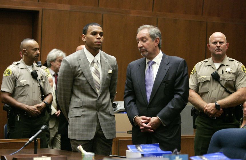 Brown and his defense attorney Mark Geragos stand during a preliminary hearing in Los Angeles on June 22, 2009, shortly after Brown pleaded guilty to assaulting Rihanna.