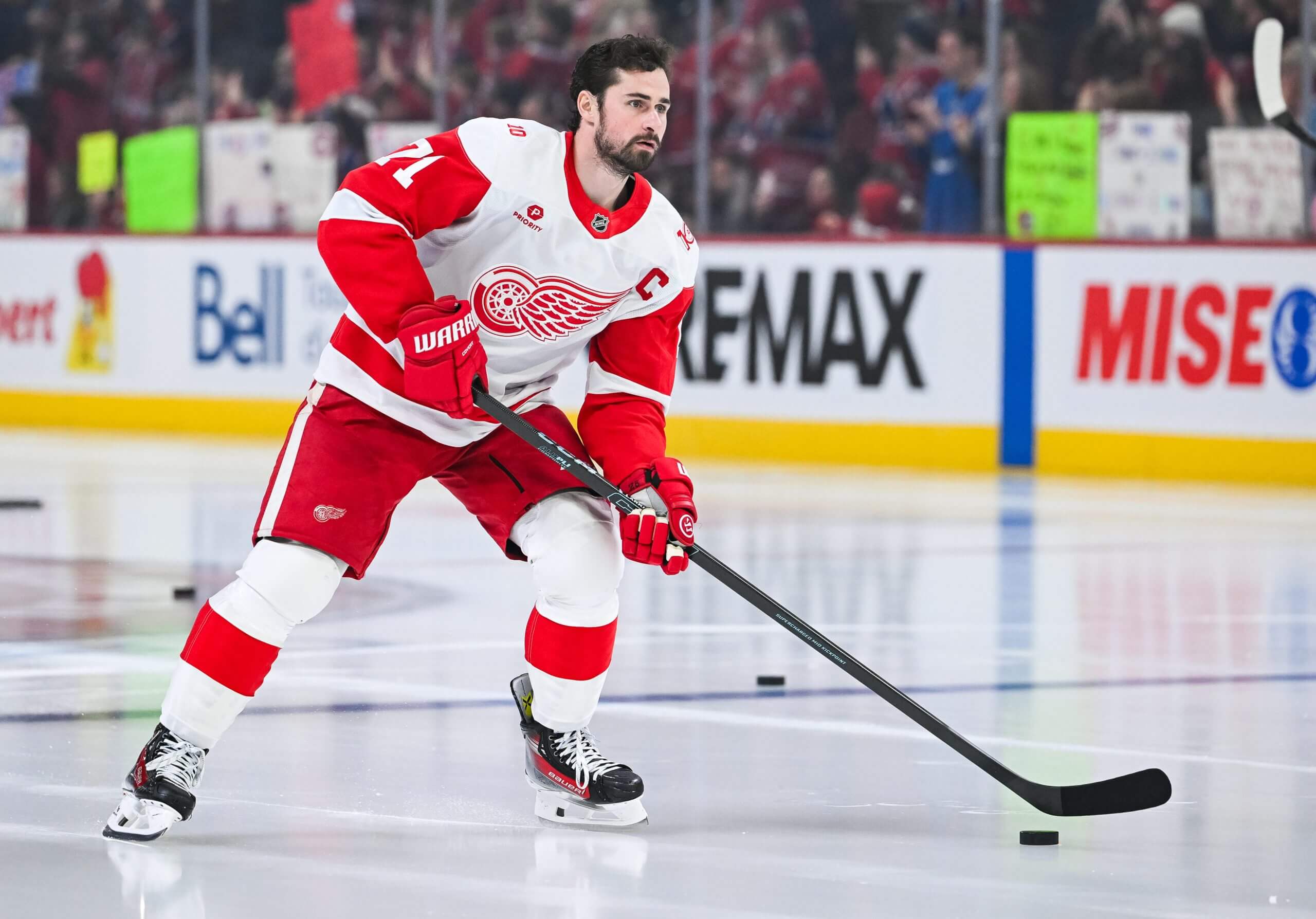 Dylan Larkin handles the puck without a helmet during warmups before a Red Wings game.