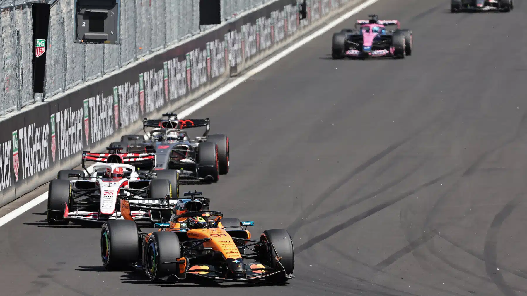 Oscar Piastri (McLaren-Mercedes) leads Esteban Ocon (Haas-Ferrari) and others during the 2026 Spanish Grand Prix