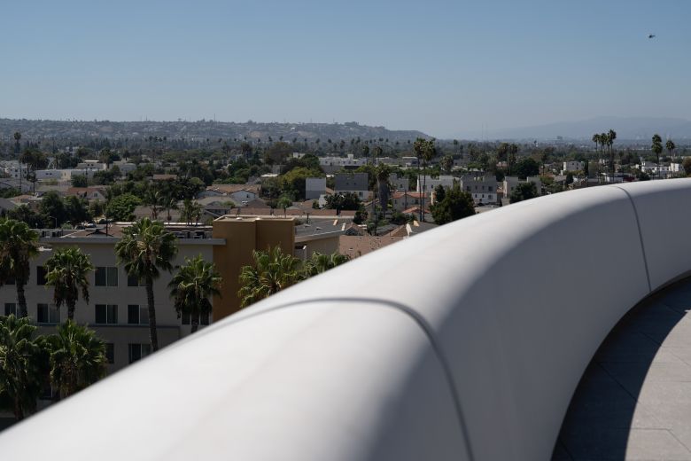 The museum is futuristic in design, with its curvy shape and tube-like elevators.