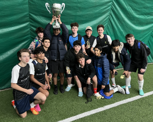 Safaei and Elite United FC With the Championship Trophy