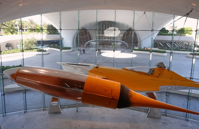 A Naboo N-1 Starfighter from the film "Star Wars: Episode I - The Phantom Menace" is suspended in the Lucas Museum of Narrative Art during a preview in Los Angeles on Aug. 31, 2026. (Chris Pizzello / AP Photo)